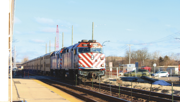 A train stops in Geneva before making a final stop at the Elburn Metra station. Towns including Aurora, Fox River Grove, Rosemont, Elmhurst and University Park also had migrants dropped off.